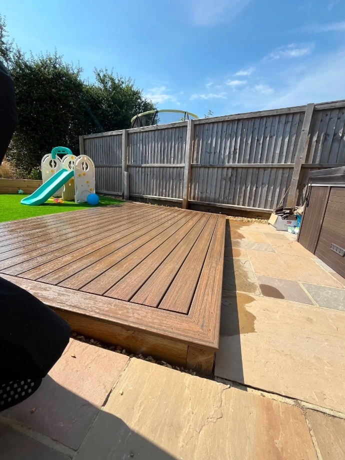 Edge and step detail of Trex Enhance Natural Toasted Sand grooved decking installed on the Isle of Wight, demonstrating the durable low-maintenance finish in a coastal environment